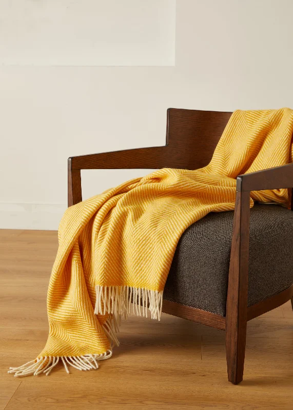 Cotton blankets for breathability and a lightweight feelFoxford Yellow Herringbone Merino Throw